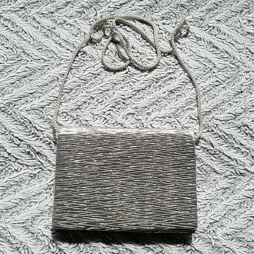 Textured silver fabric covered clutch handbag